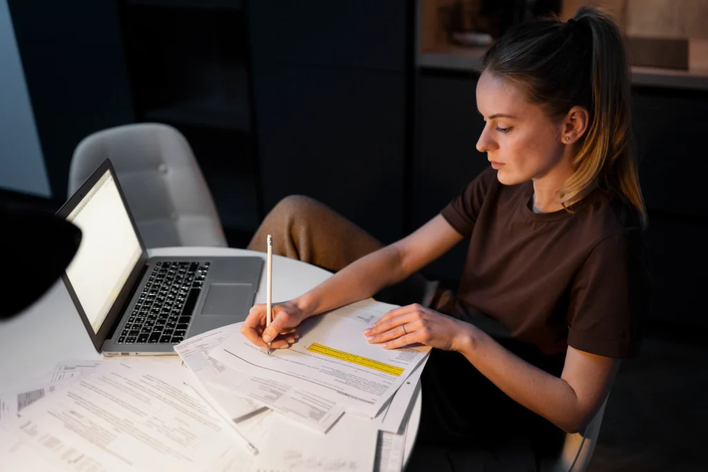 medium-shot-woman-working-laptop